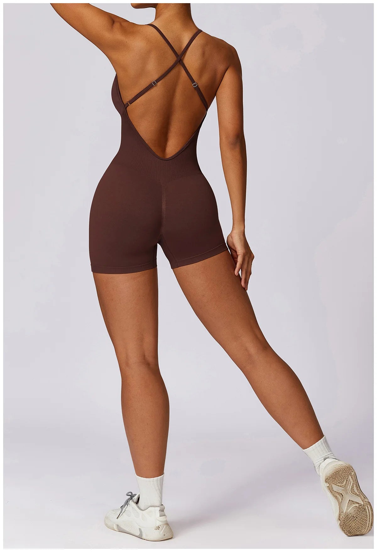 Xooie Fit women's fitness one-piece in brown with a stylish cross-back design and shorts