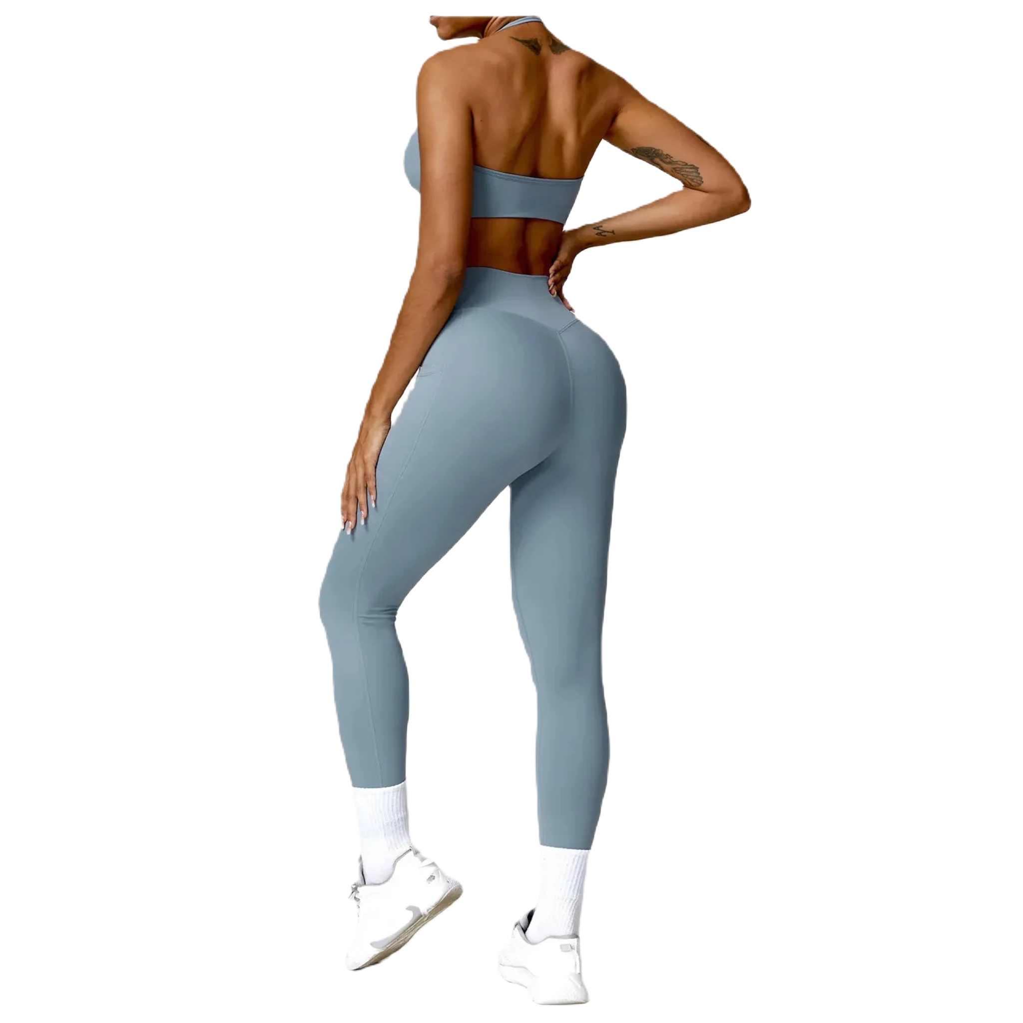 Stylish women's fitness two-piece set in light blue featuring a crop top and high-waisted leggings