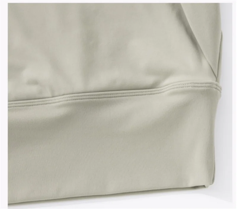 Light green women's fitted activewear top with a smooth finish and comfortable fit
