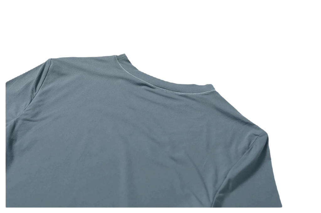 Xooie Fit women's fitted workout top in a soft grey color with a sleek design for comfortable workouts