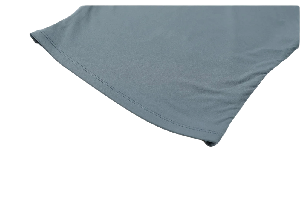Close-up of Xooie Fit women's fitted workout top showcasing stretchy fabric and sleek design