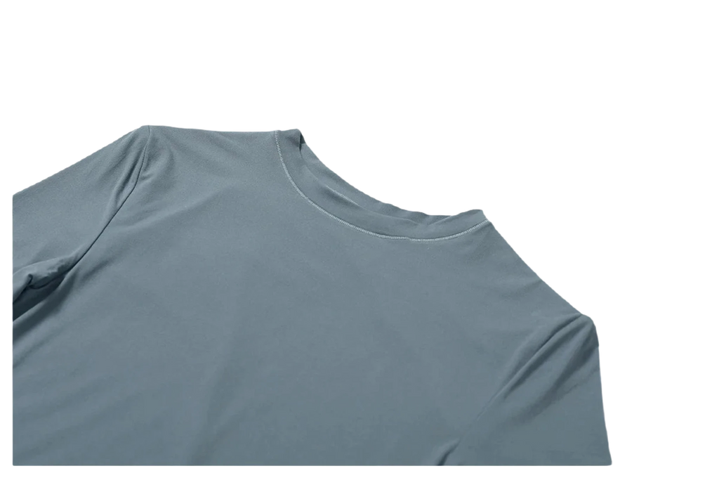 Xooie Fit women's fitted workout top in soft blue fabric for comfortable exercise