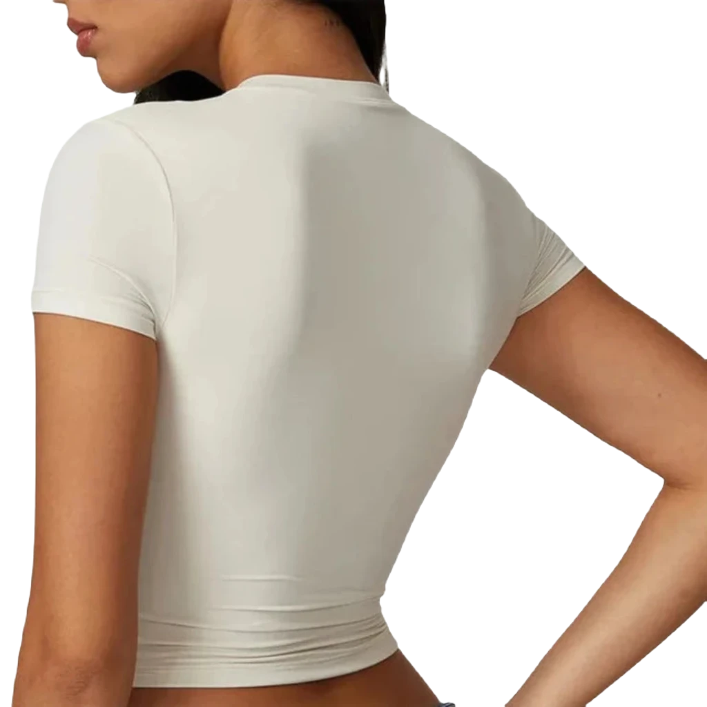 Xooie Fit women's fitted workout top in white with a sleek, flattering design for active wear