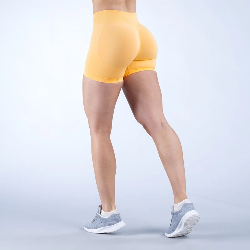 Xooie Fit women's high intensity shorts in yellow for optimal performance during workouts