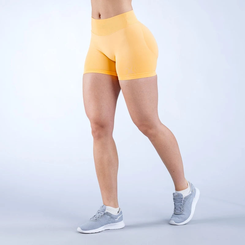 Xooie Fit women's high intensity shorts in yellow, perfect for workouts and active lifestyles