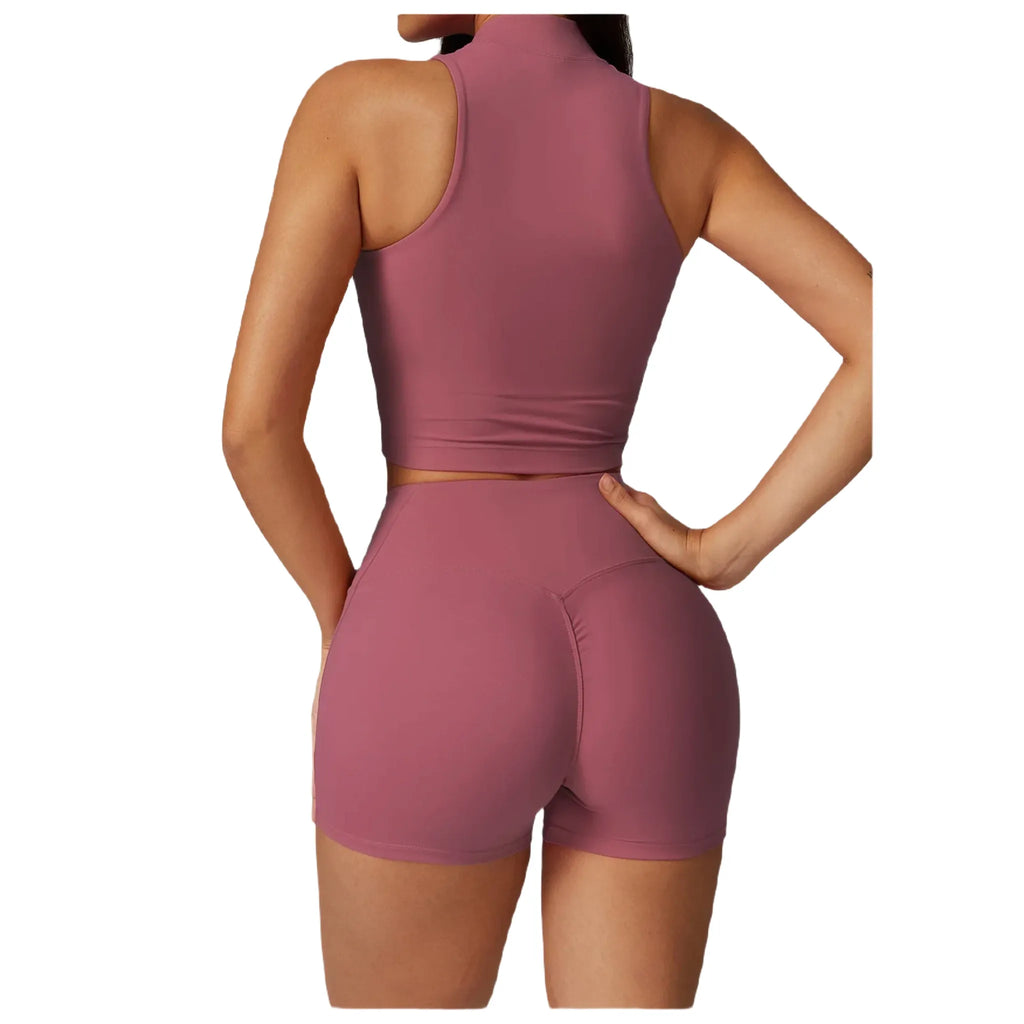 Back view of Xooie Fit women's high-performance active top in mauve with sporty design