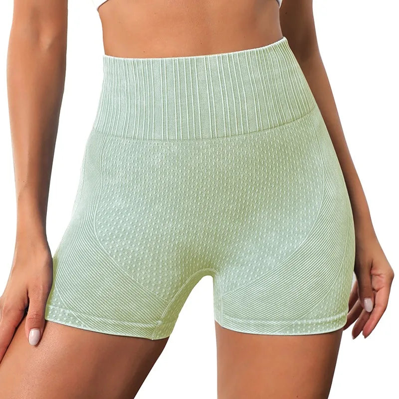 Xooie Fit women's high-waisted active shorts in light green with textured fabric for comfortable workouts