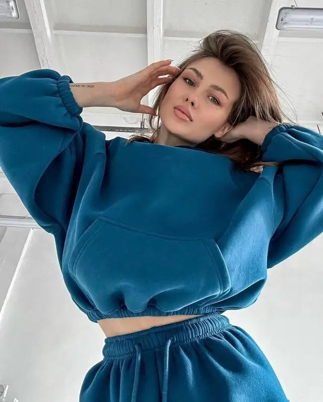 Xooie Fit women's jogger hoodie set in teal featuring a cropped hoodie and matching joggers