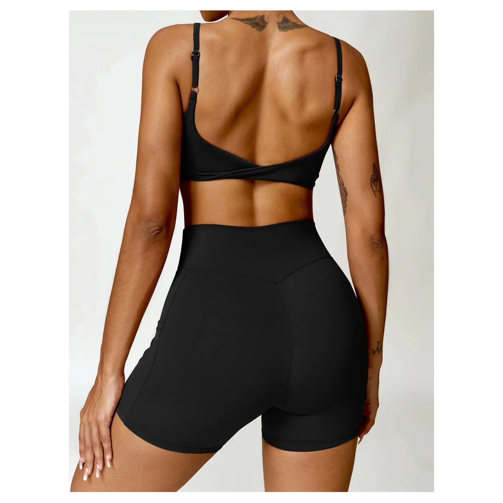 Stylish Xooie Fit women's two-piece workout set featuring a crop top and high-waisted shorts in black