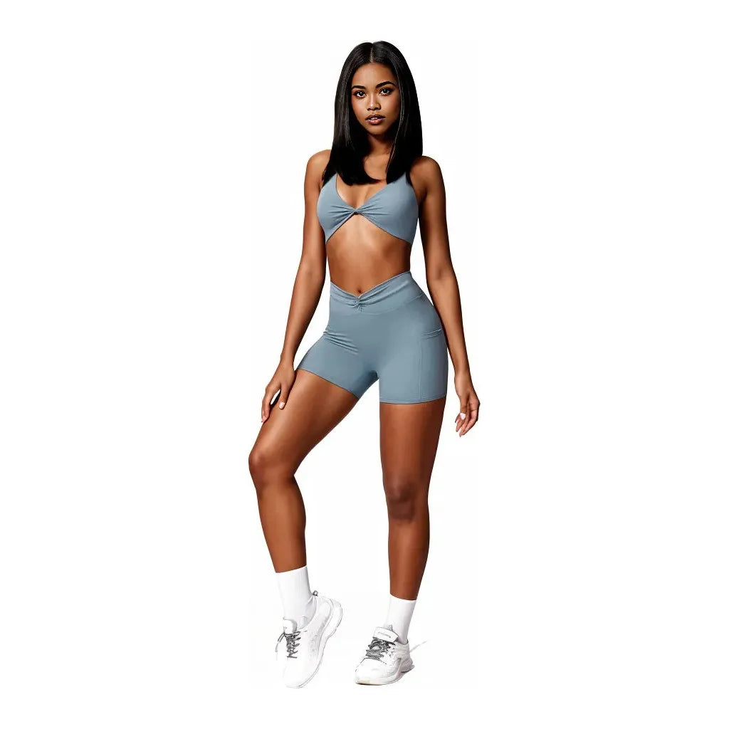 Xooie Fit women's two-piece workout set in blue featuring a stylish crop top and high-waisted shorts