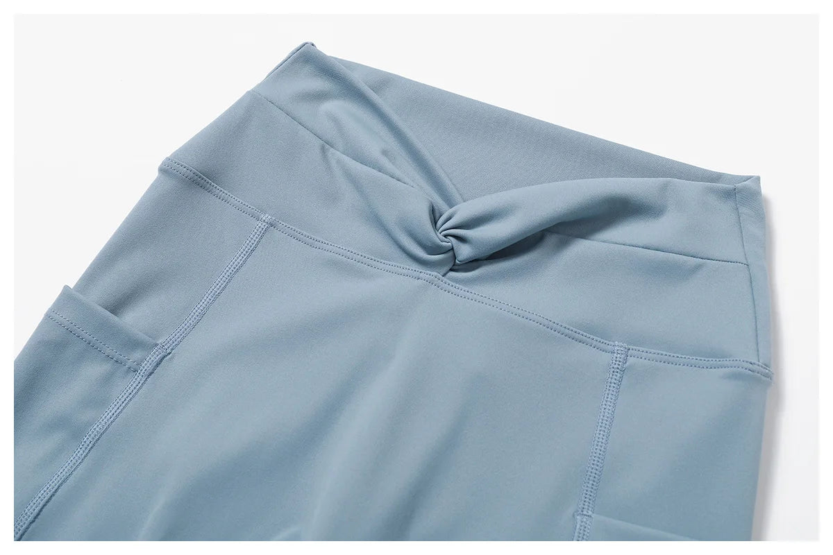 Light blue women's two-piece workout set featuring a stylish knotted top design