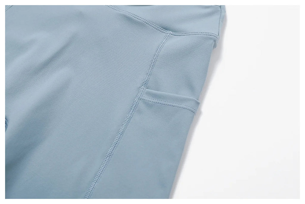 Blue women's two-piece workout set with comfortable fabric and pocket detail for fitness activities