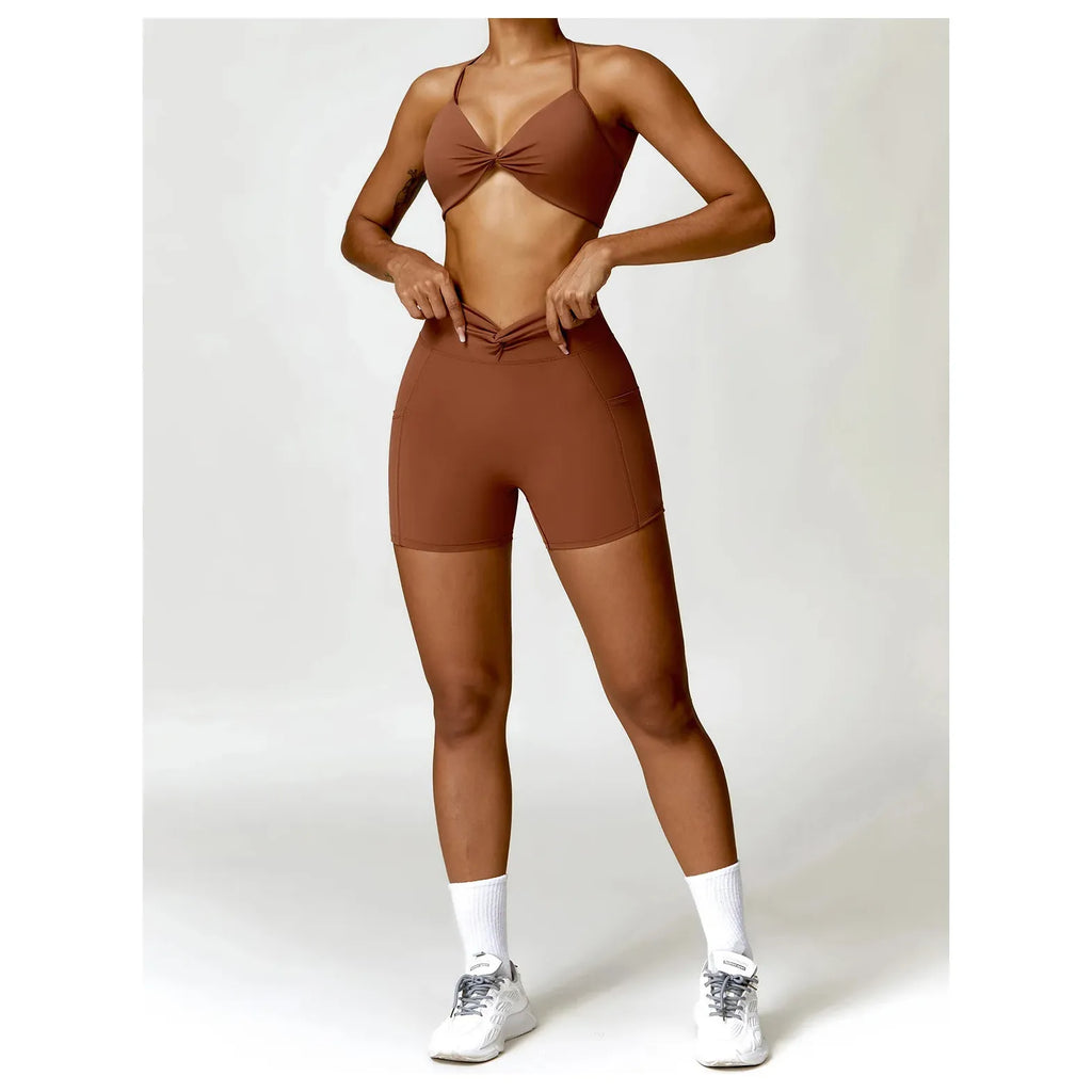 Xooie Fit women's two-piece workout set in brown with a stylish crop top and fitted shorts