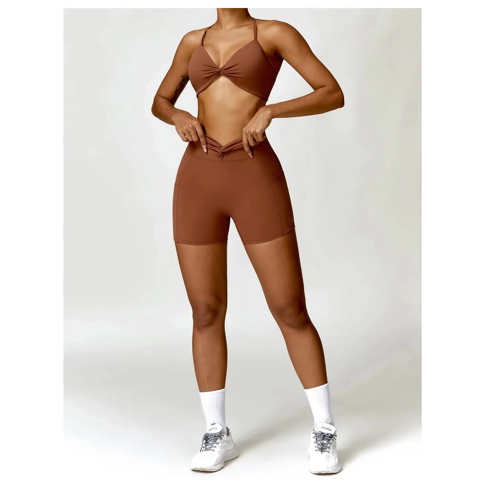 Xooie Fit women's two-piece workout set in brown with a stylish crop top and fitted shorts