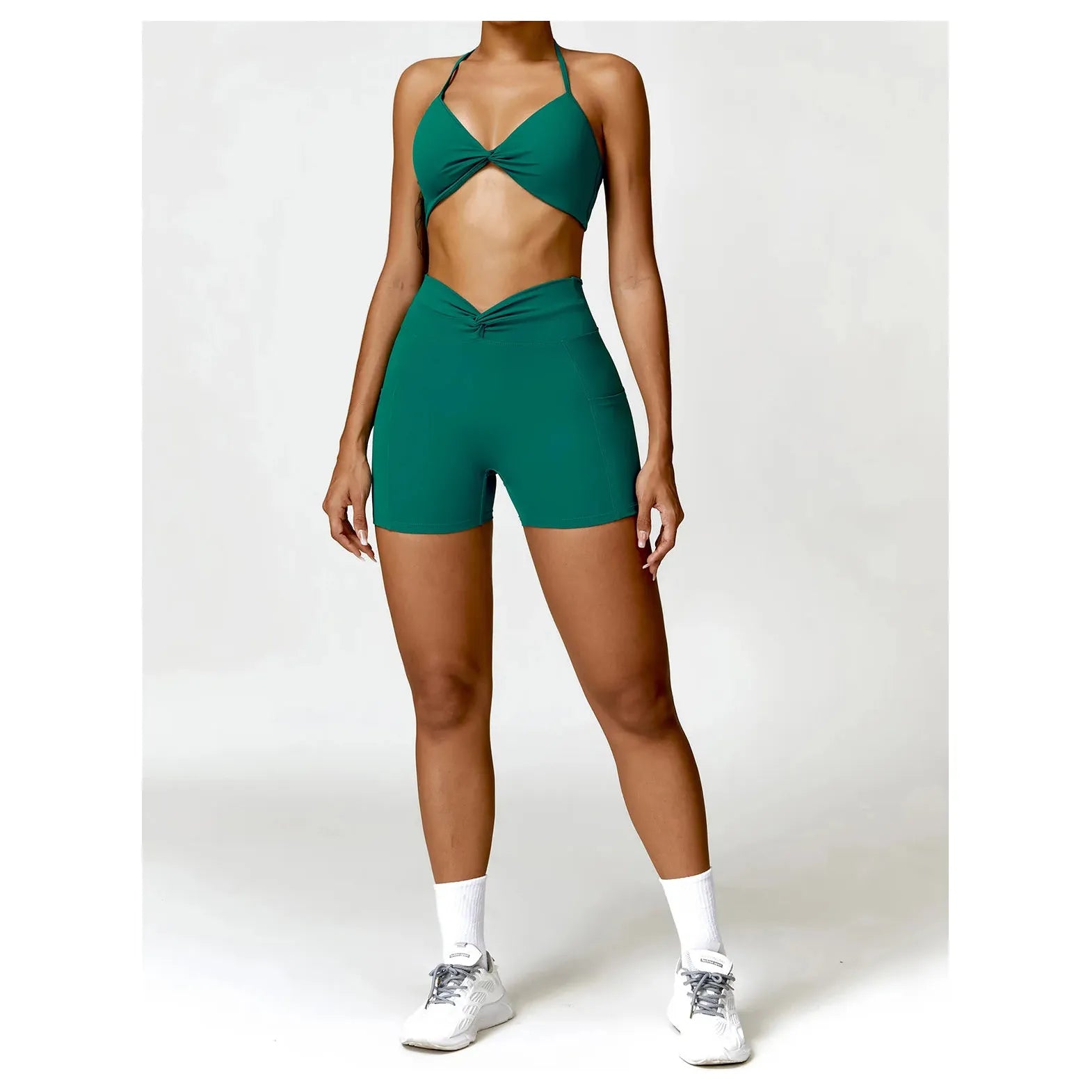 Xooie Fit women's two-piece workout set in green, featuring a stylish crop top and high-waisted shorts