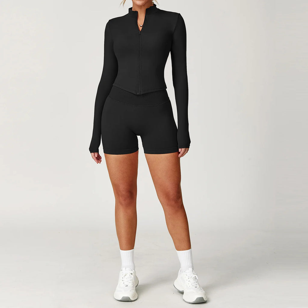 Black fitted zip jacket and matching active shorts set, front view