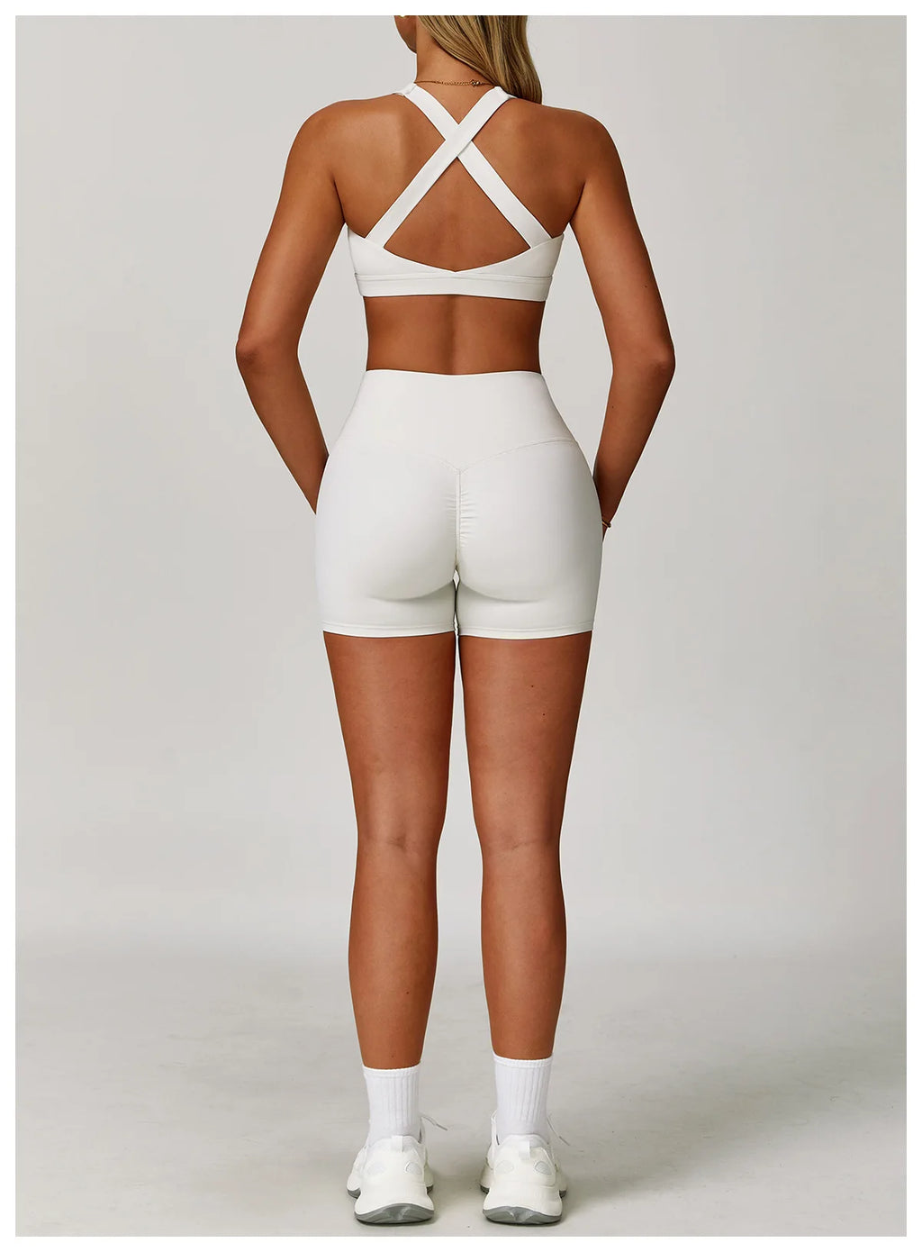 X-back sports bra and shorts set in white, perfect for workouts and active wear enthusiasts