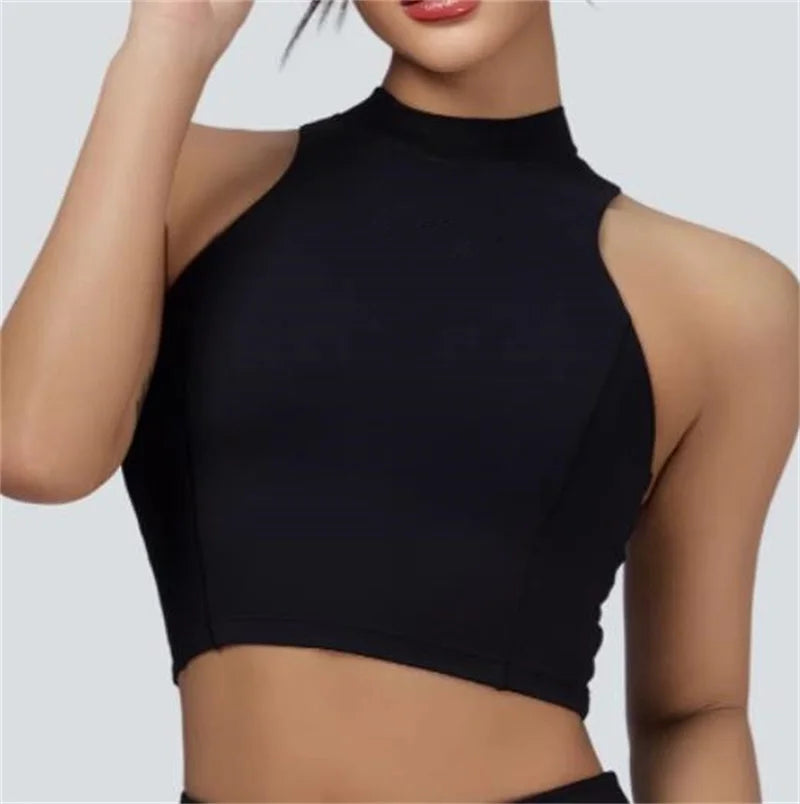 Women's black vest crop top and skort set from Xooie Fit with sleeveless high neckline design