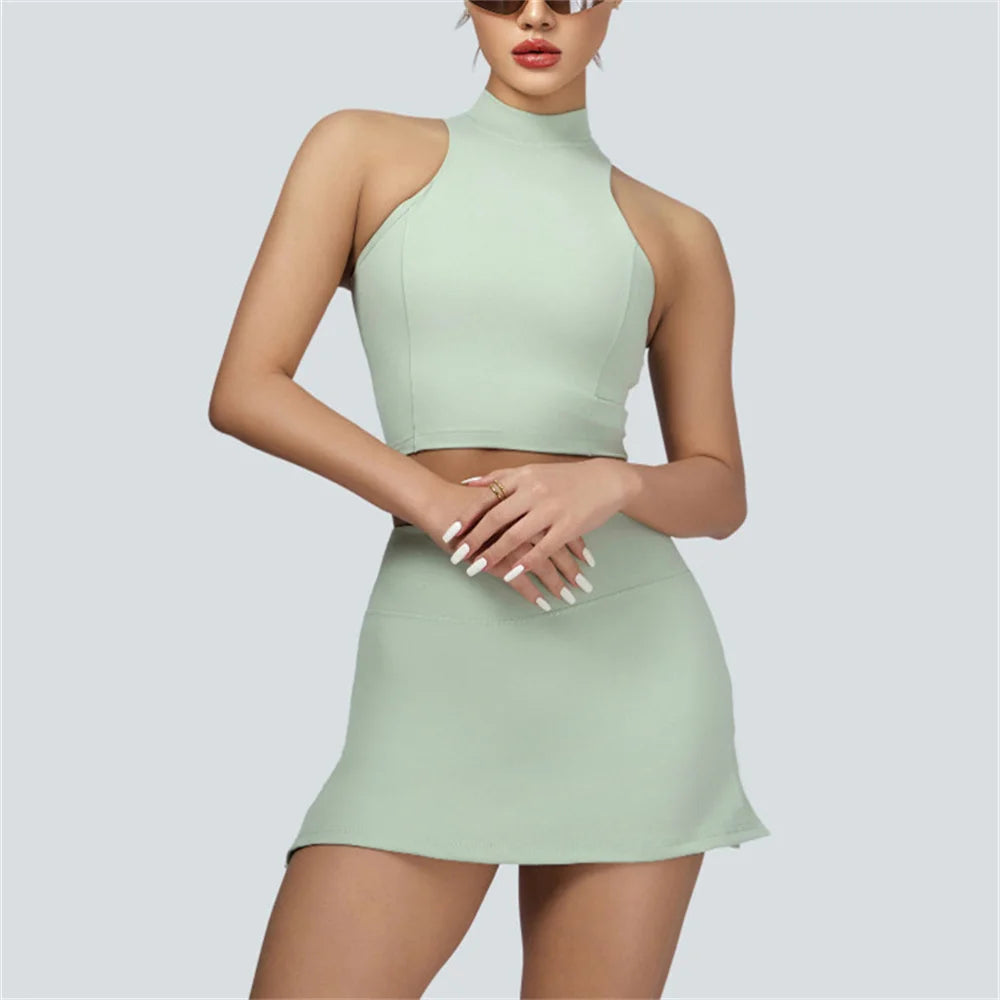Xooie Fit vest crop top and skort set in light green sleeveless high neck style