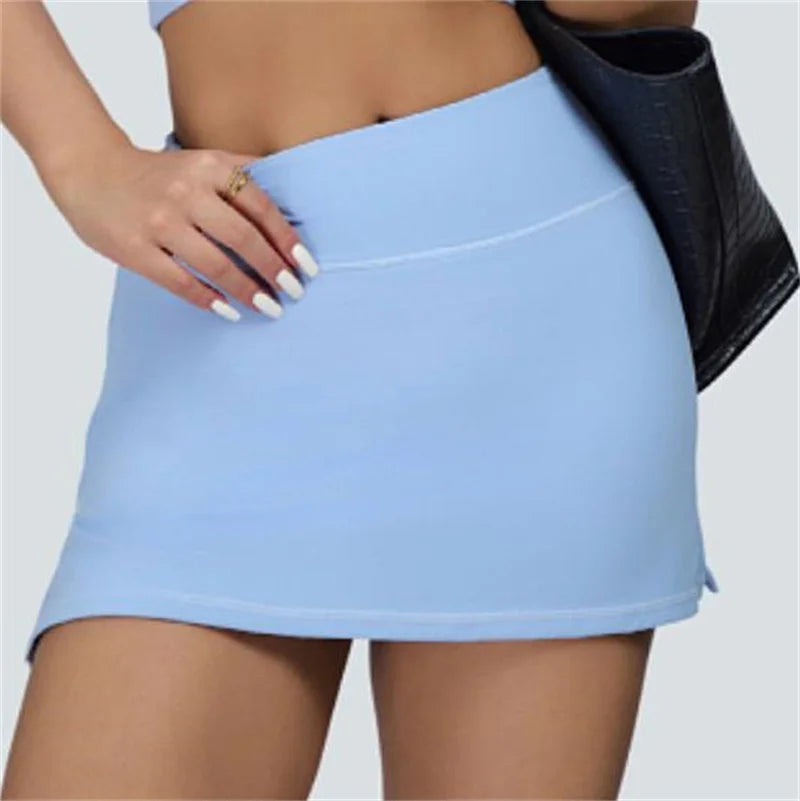 Light blue vest crop top and skort set bottom piece from Xooie Fit with a close-up of the skort