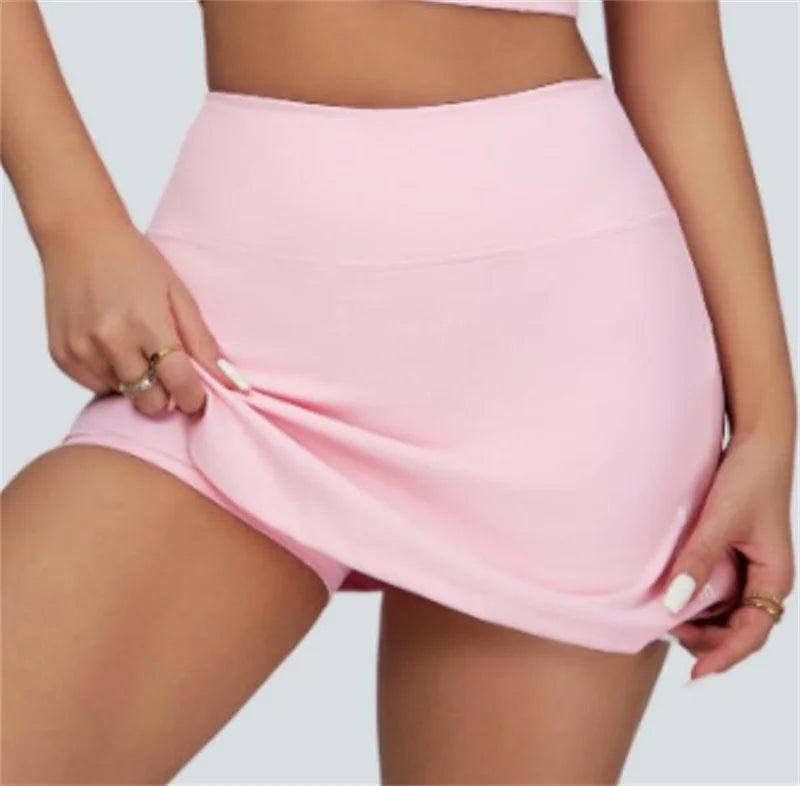 Xooie Fit pink vest crop top and skort set showing stretchable skort fabric and fitted design