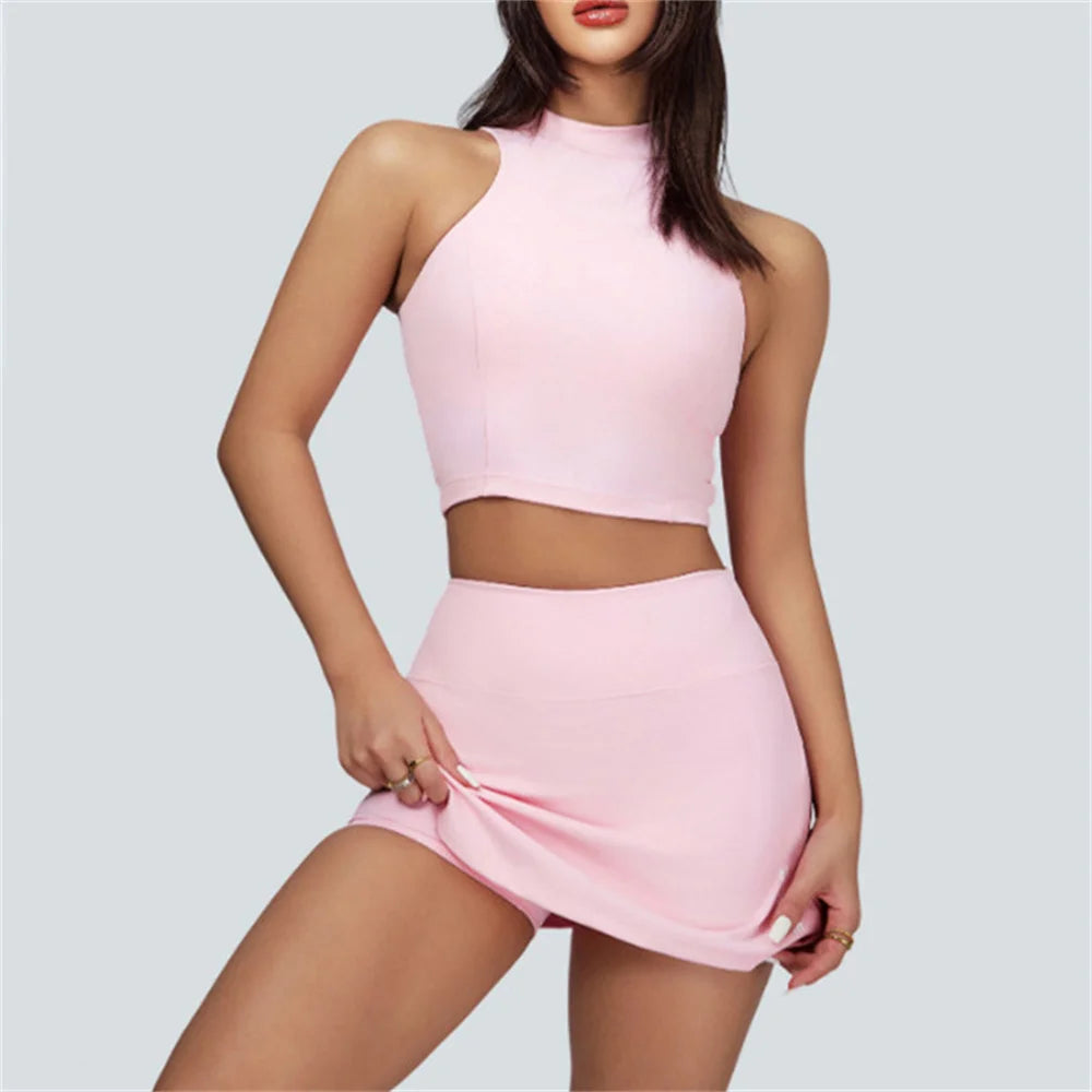 Xooie Fit pink vest crop top and skort set with high neckline and fitted design for women