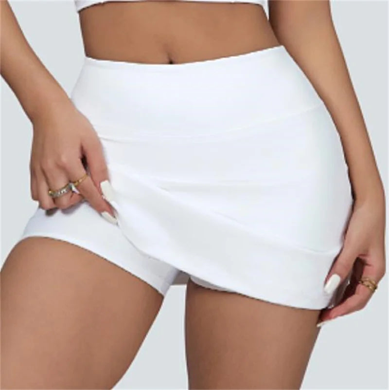 Xooie Fit white vest crop top and skort set featuring a high waist skort with shorts underneath