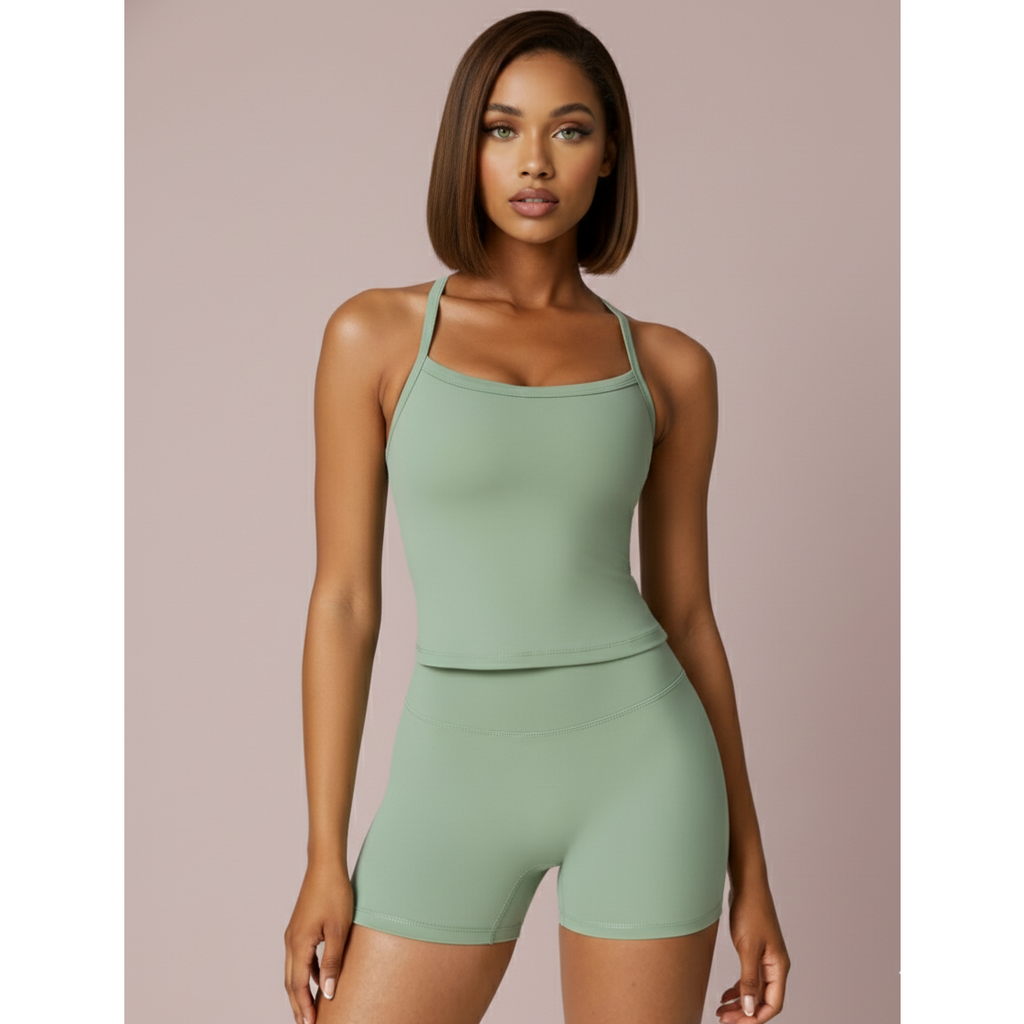 Woman wearing a green athletic outfit on a beige background