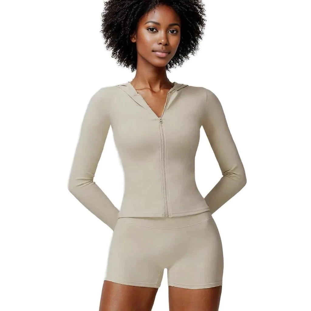 Xooie Fit Women's Athletic Set in Beige featuring a zip-up long sleeve top and matching shorts