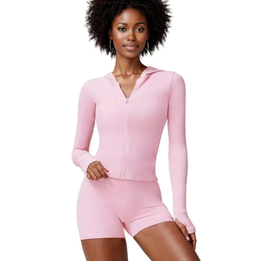 Xooie Fit women's athletic set in pink featuring a zip-up hoodie and matching shorts