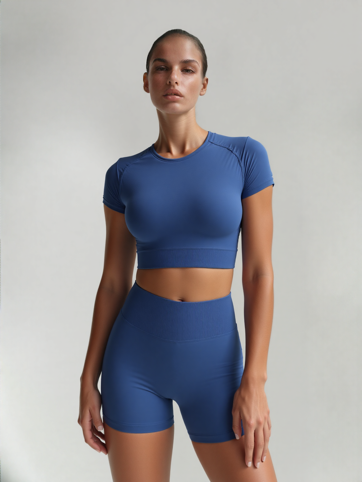 Xooie Fit women's fitted activewear set in blue with a stylish cropped top and matching shorts