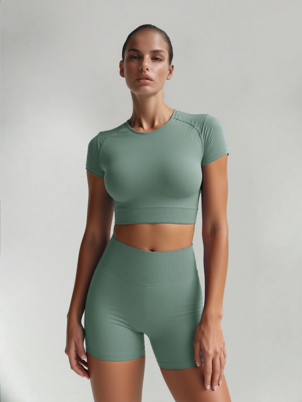 Xooie Fit women's fitted activewear set in green with a cropped top and matching shorts