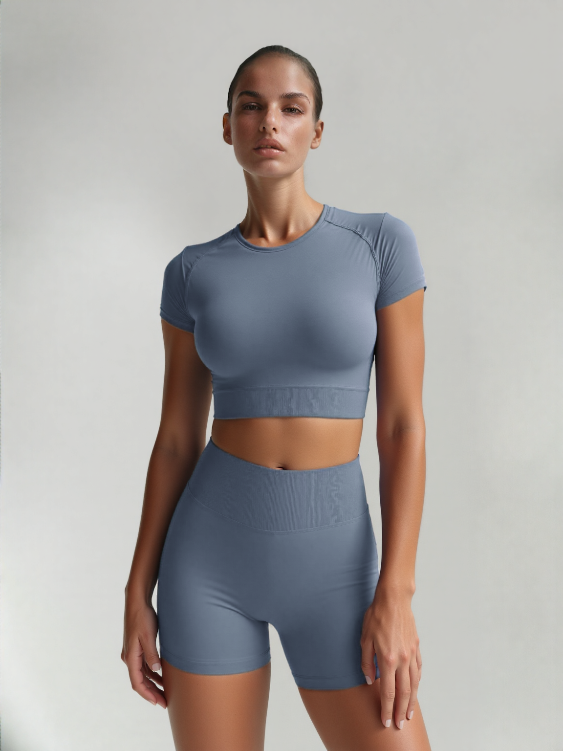 Xooie Fit women's fitted activewear set in blue with short sleeves and high-waisted shorts