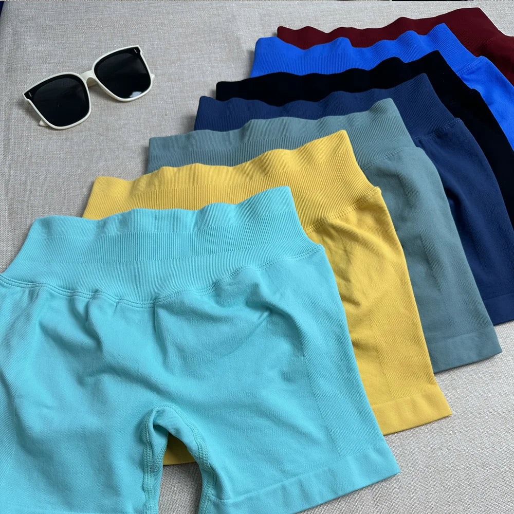 Women's fitted activewear set featuring colorful shorts in various shades for stylish workouts