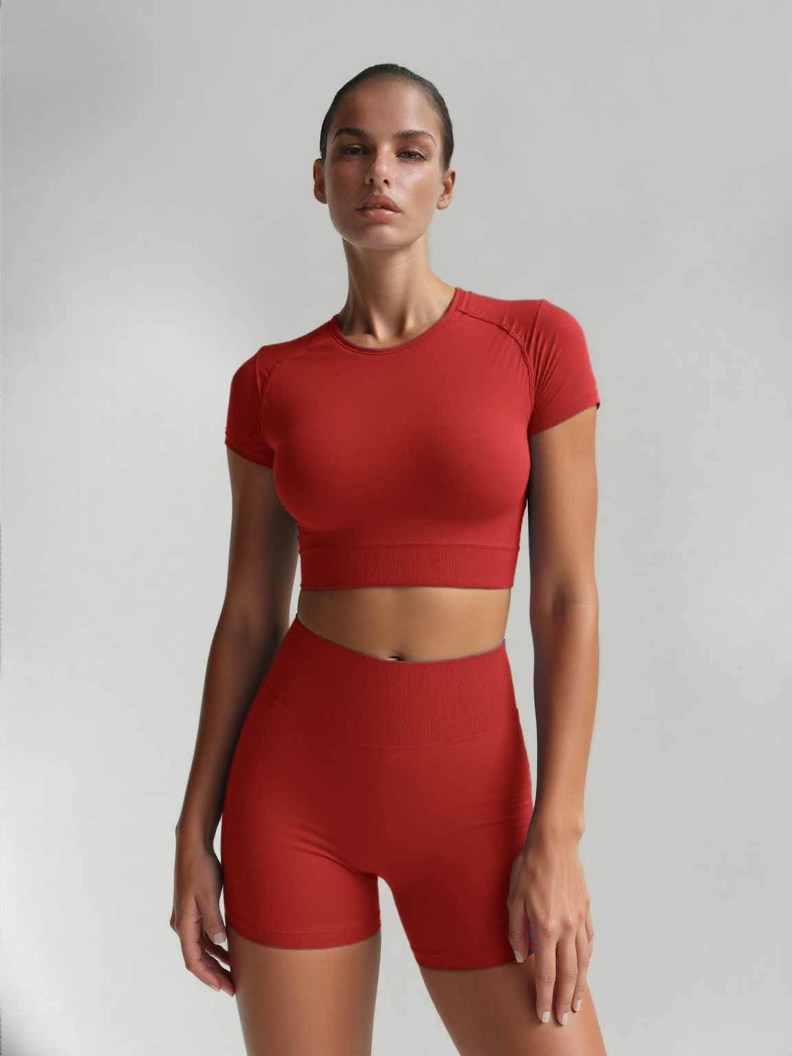 Xooie Fit women's fitted activewear set in red with cropped top and high-waisted shorts for optimal comfort
