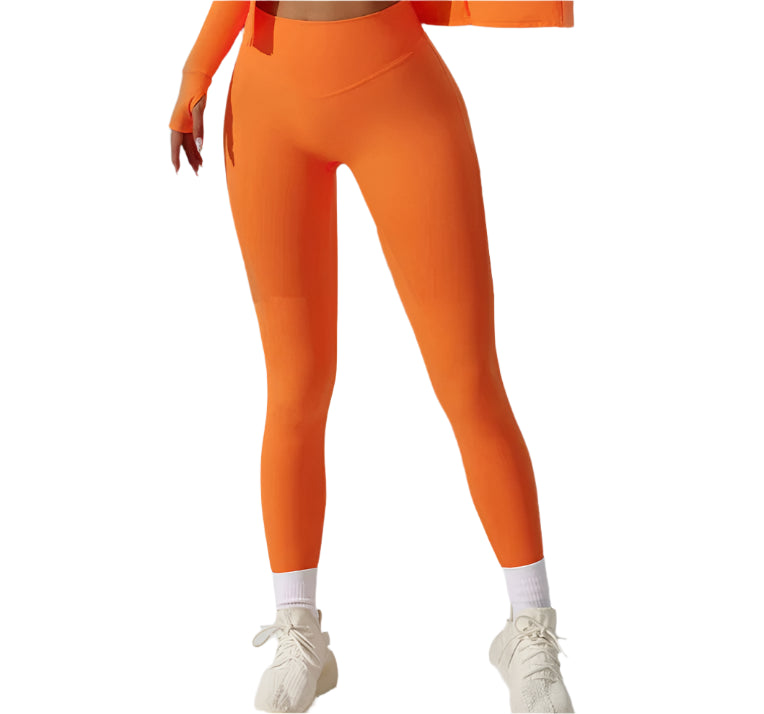 Bright orange high performance leggings for women, designed for comfort and movement during workouts