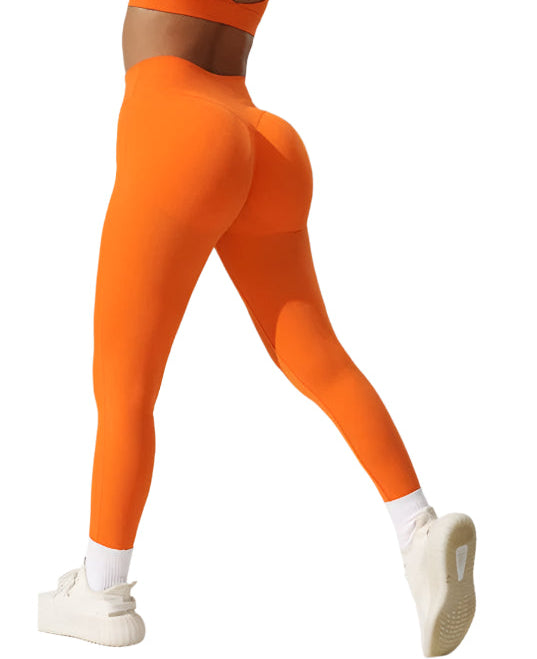 Bright orange high performance leggings for women designed for comfort and style during workouts