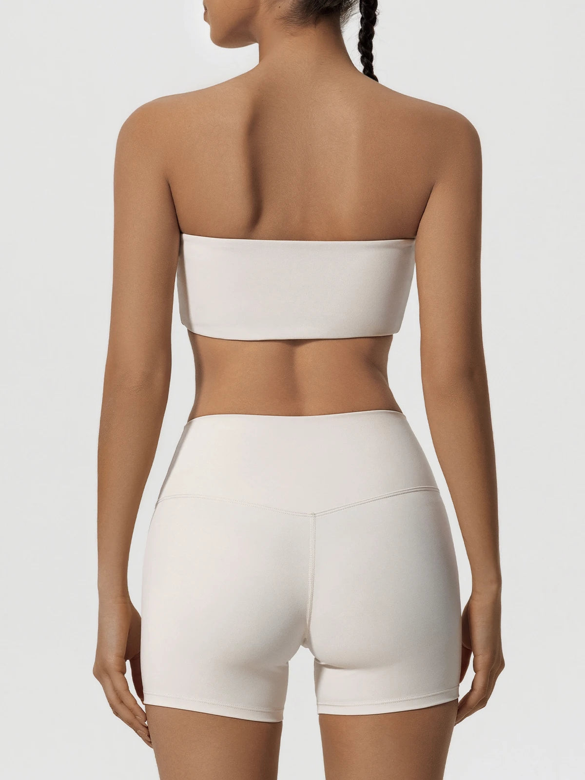 Women’s ivory strapless sports bra and biker shorts set, back view
