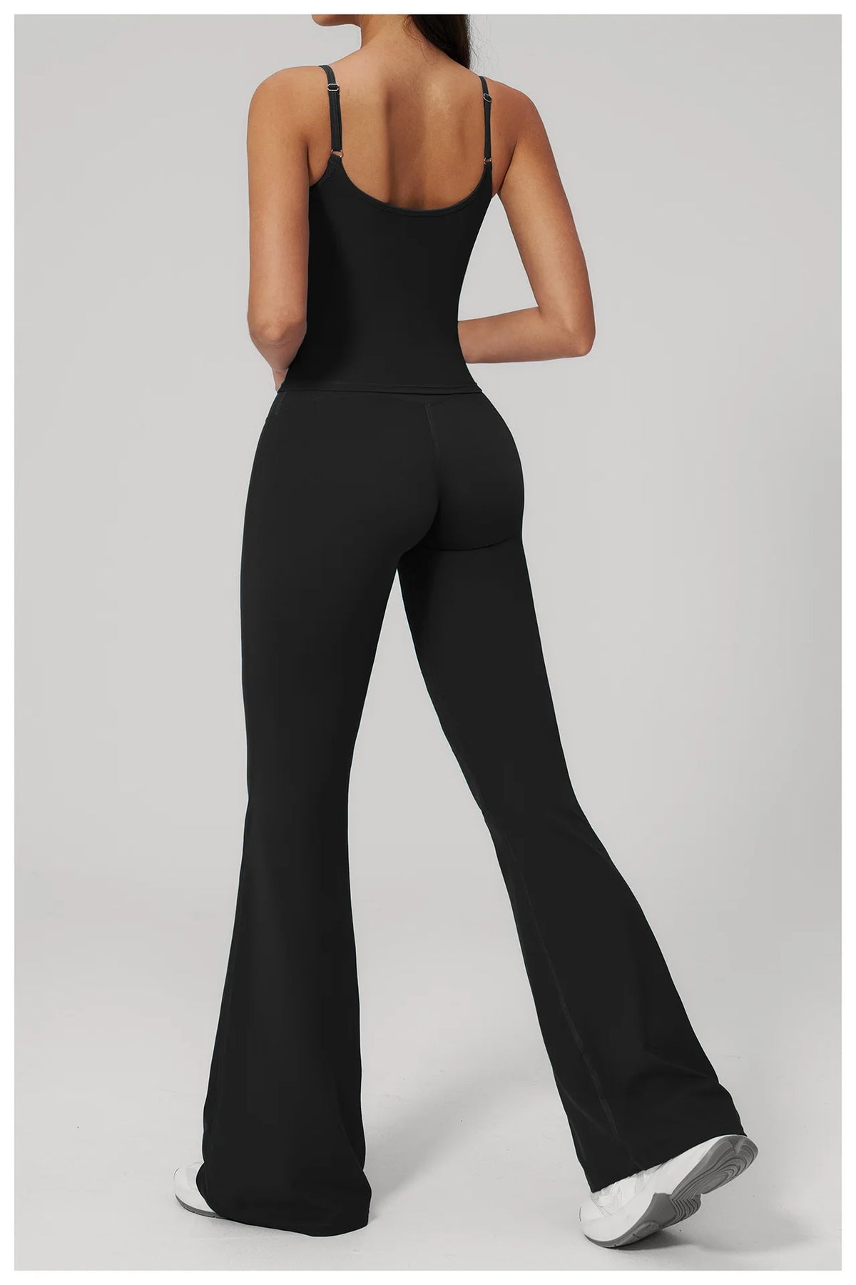 Women’s black sports set from back: spaghetti-strap tank with wide-leg pants