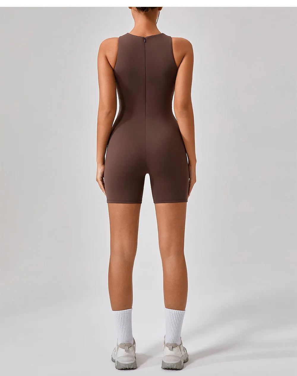 Hauncha brown active romper back view with center back zipper detail.