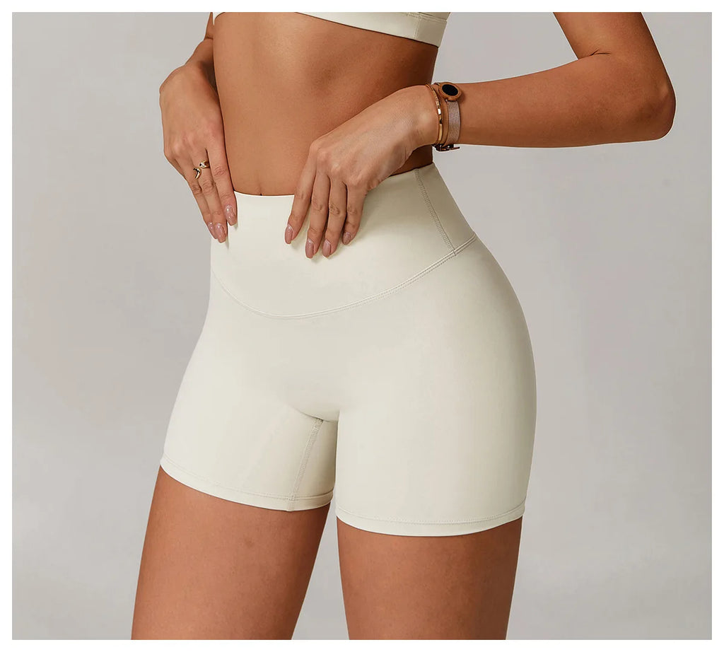 Xooie Fit women's active shorts in cream color with high waist and smooth fabric