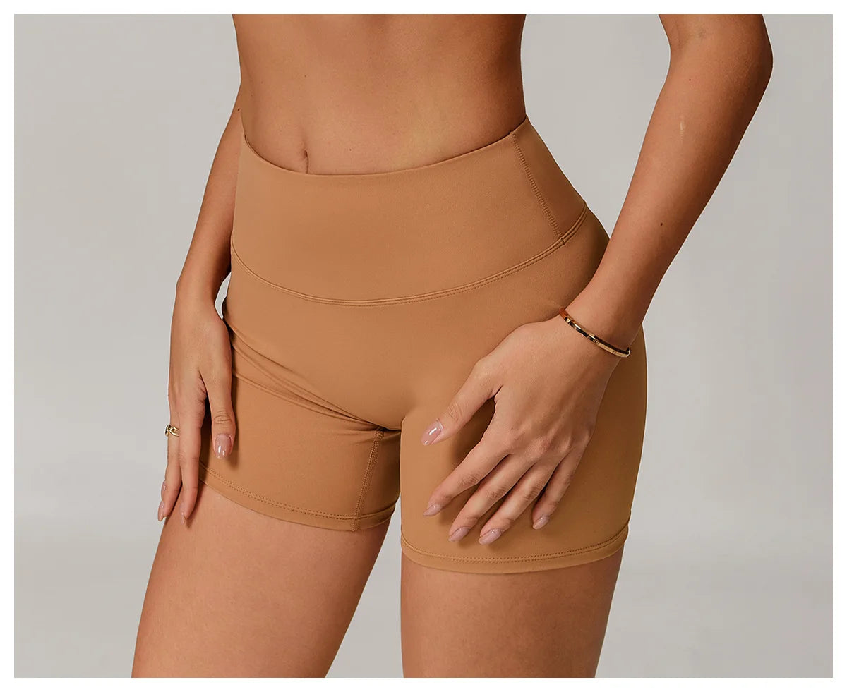 Xooie Fit women's active shorts in tan color with high waist and smooth fabric fit