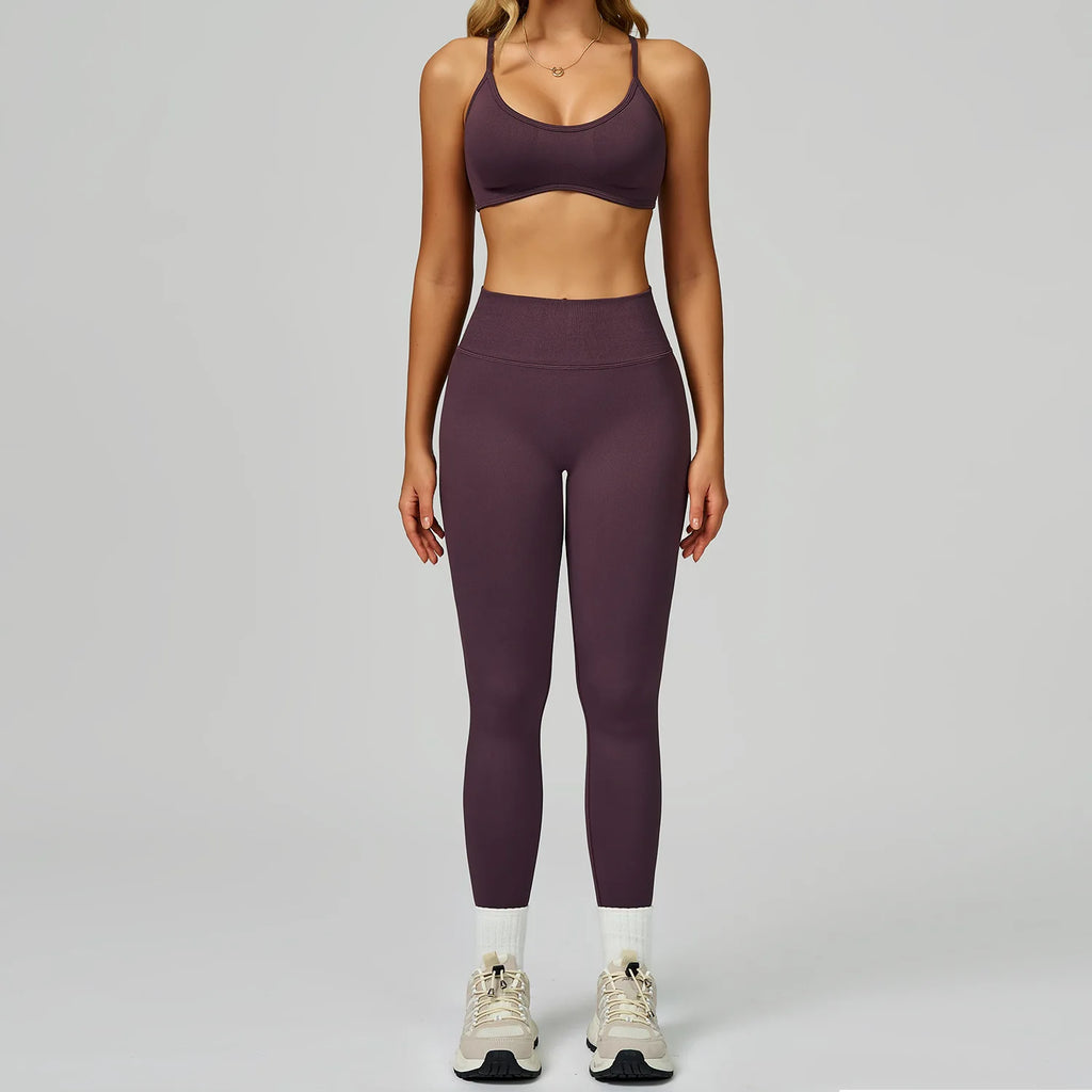 Xooie Fit women's activewear matching set in dark purple featuring a sports bra and high-waisted leggings