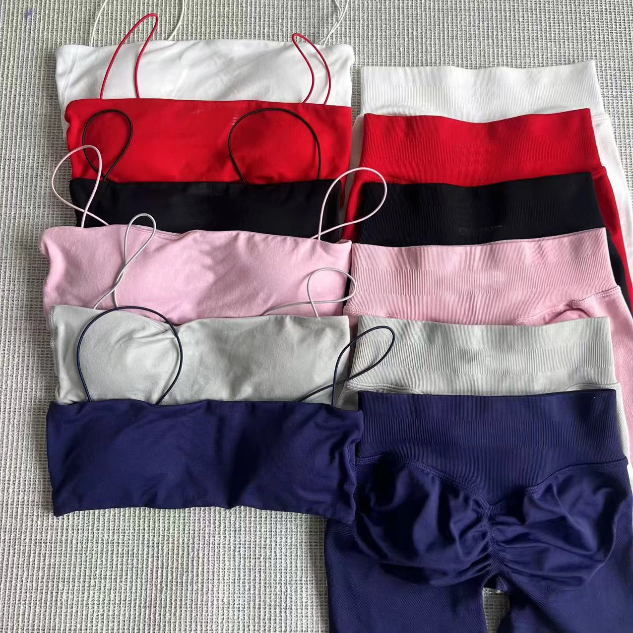 Assorted thin strap bra and high-waisted leggings sets in multiple colors