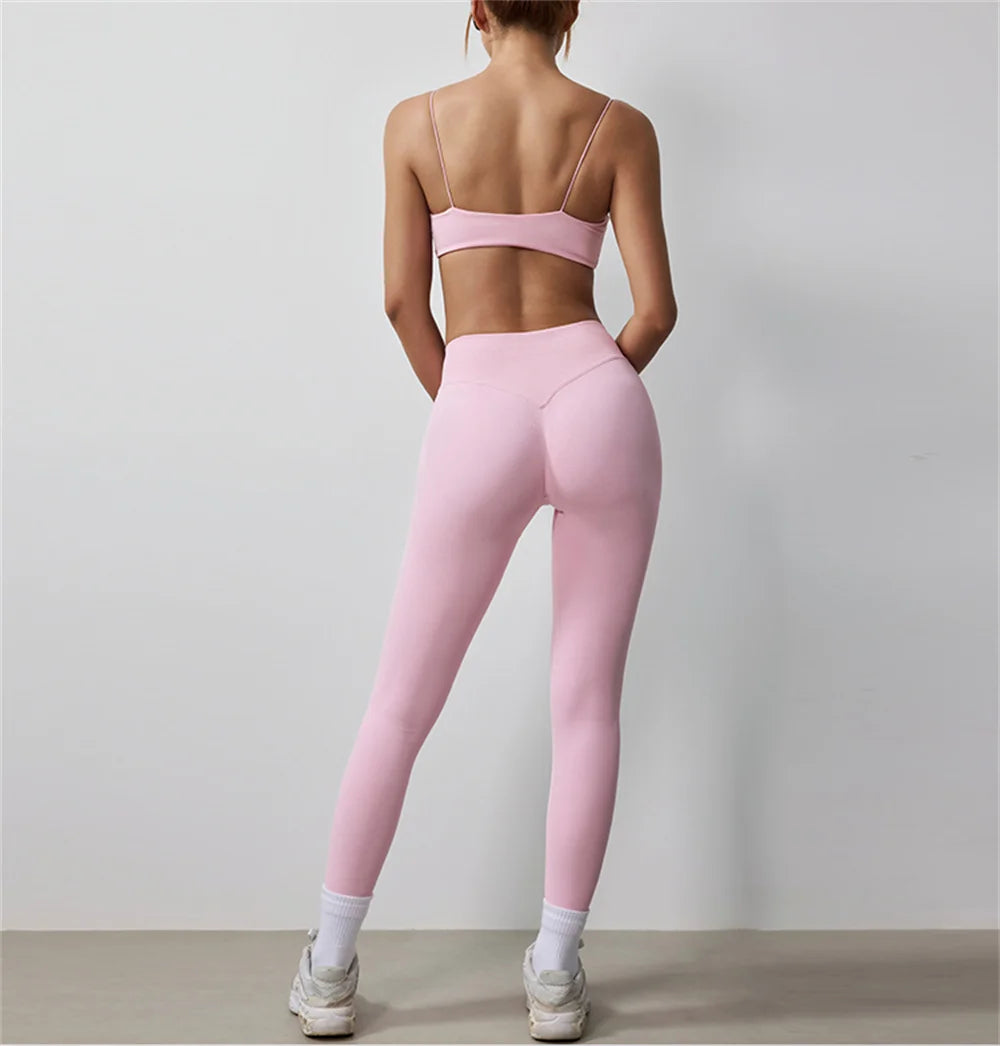 Pink thin strap bra and high-waisted leggings active set, back view
