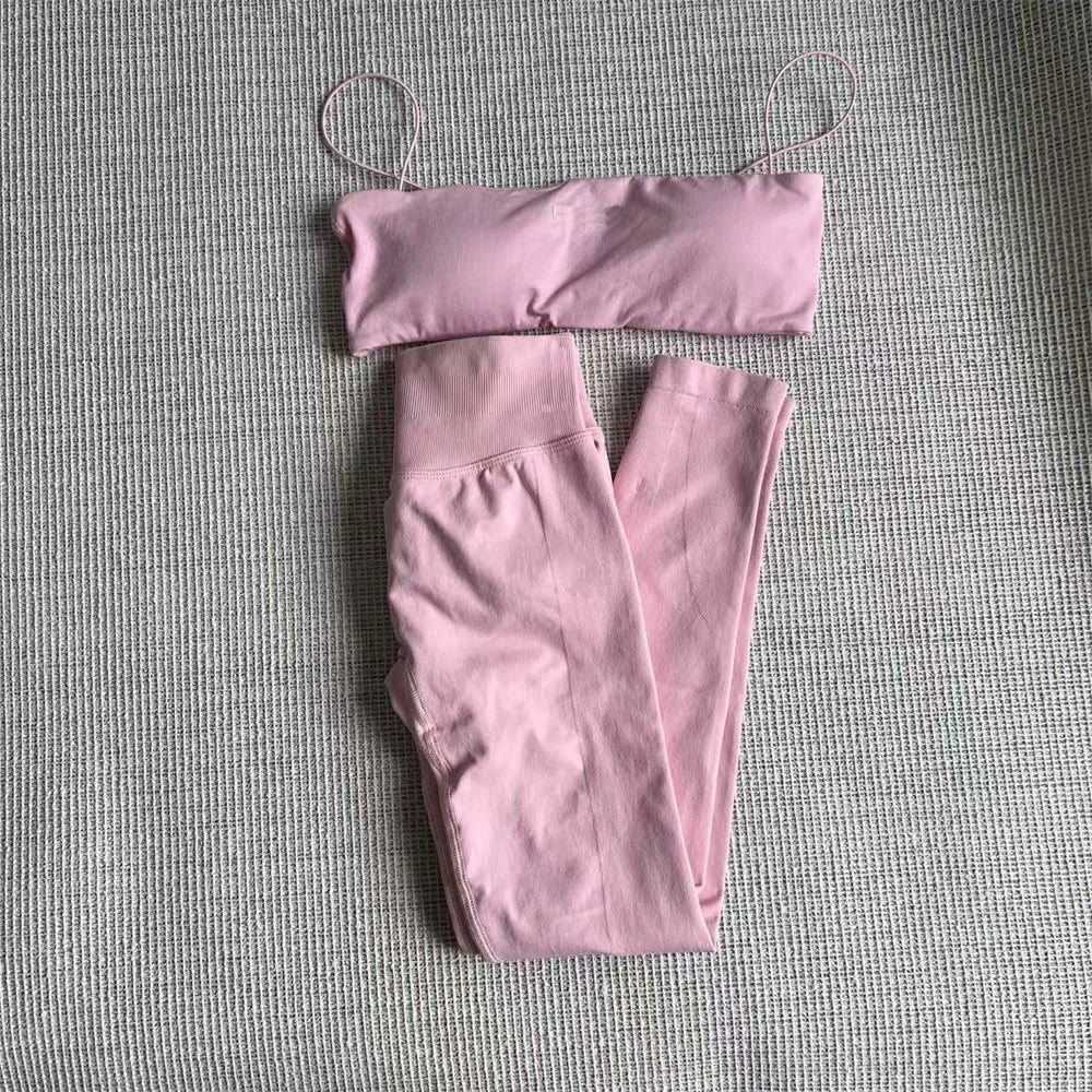 Dusty pink thin strap bra and high-waisted leggings set, laid flat