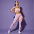 Pink thin-strap sports bra and high-waisted leggings matching set