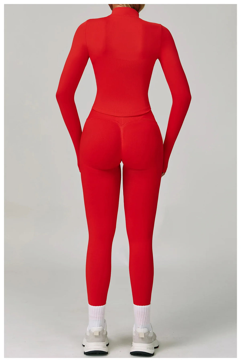 Women's activewear matching set in red featuring a long-sleeve top and fitted leggings