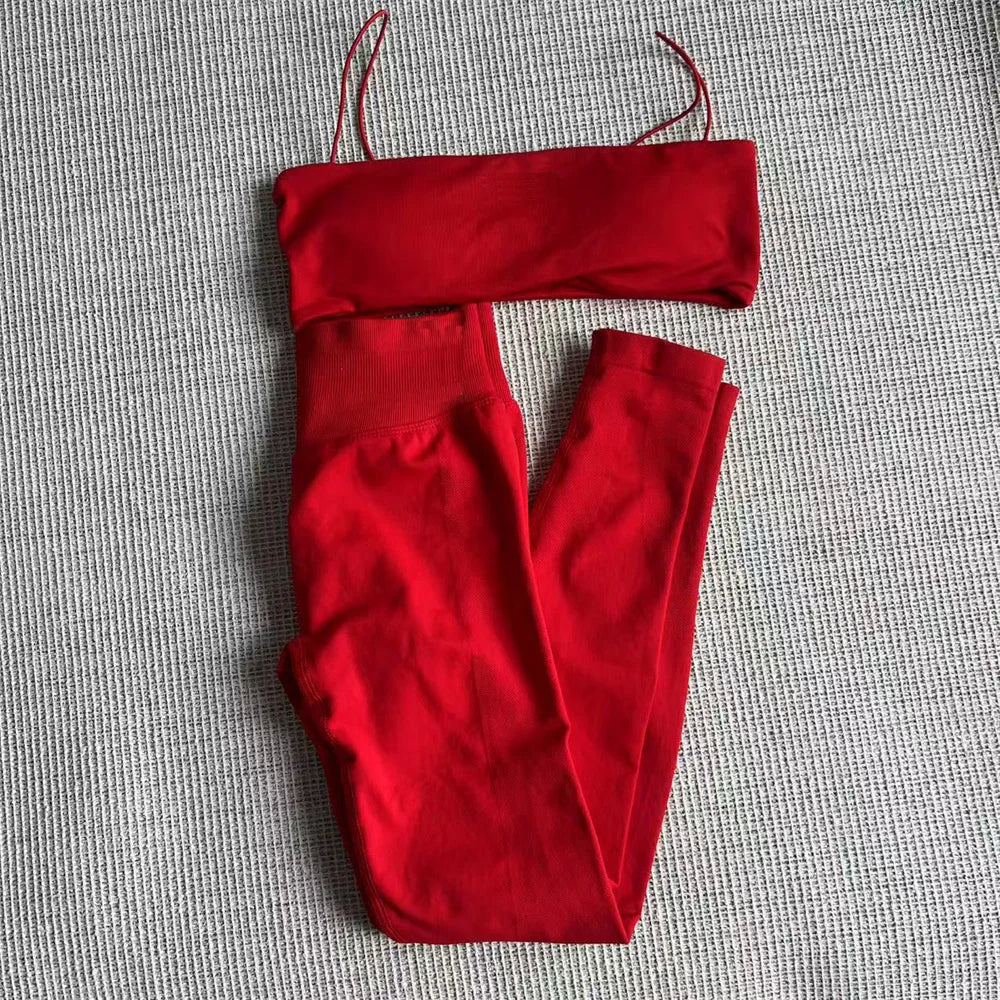 Red thin strap bra and high-waisted leggings set, laid flat