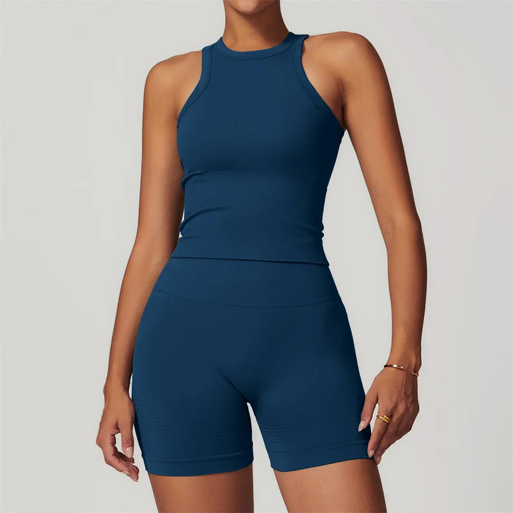 Xooie Fit women's activewear set in navy blue with sleeveless crop top and high-waisted shorts